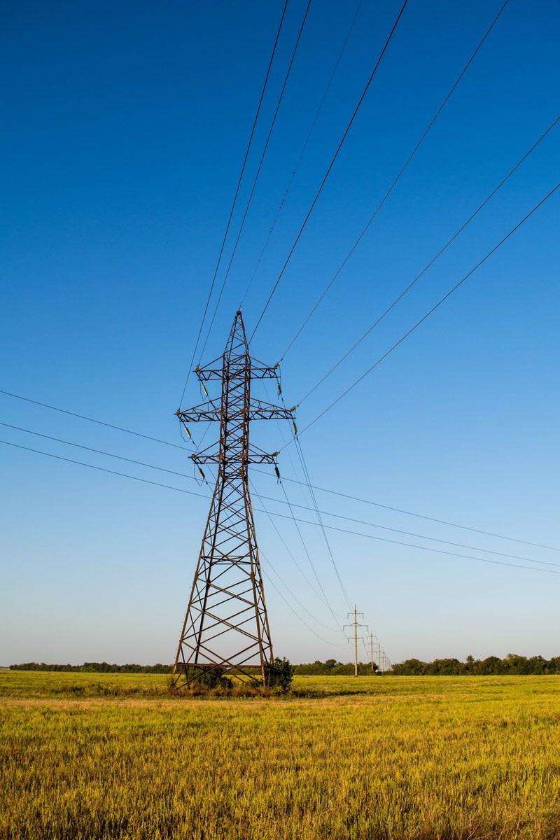 power lines and an electrical tower in the middle of a country field, country powerlines 4k