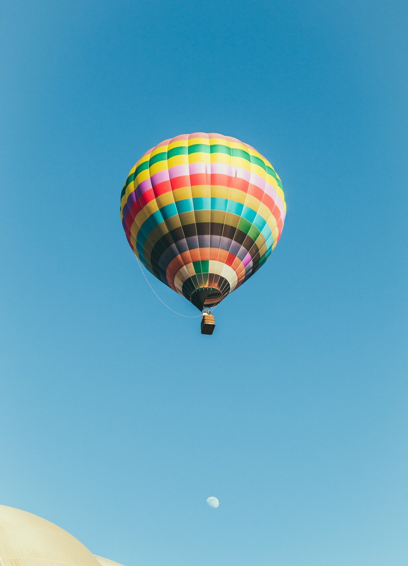 a hot air balloon appears to fly over the moon at rancho santa fe, hot air balloon and the moon 4k