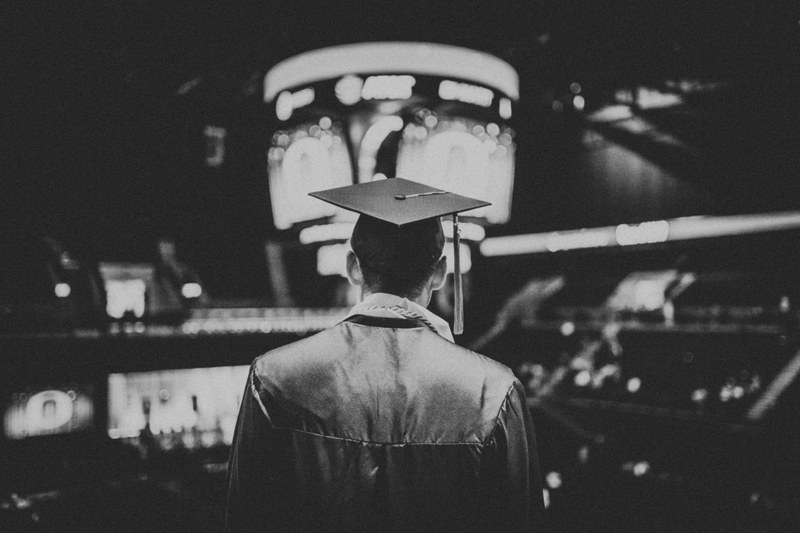 black and white shot of graduated student wearing cap and gown from behind eugene or euo, college graduation 4k