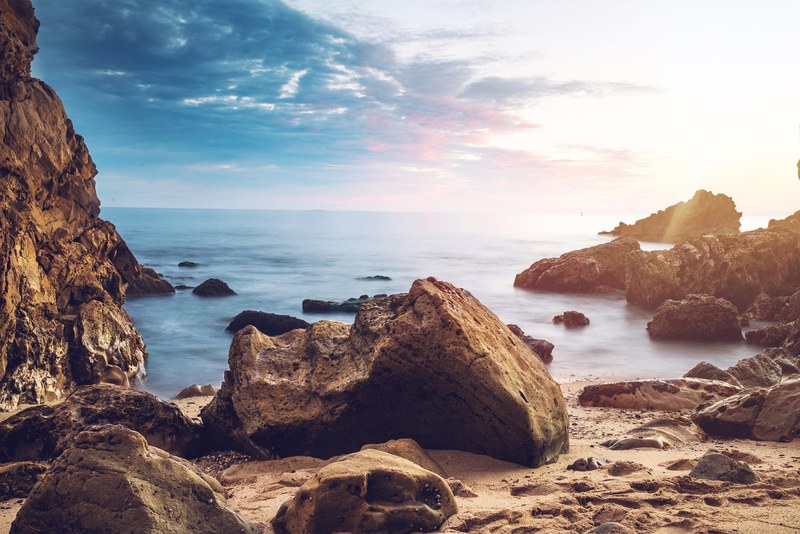 sunrise over rocky beach on a cloudy day in little corona beach, little corona beach sunrise 4k
