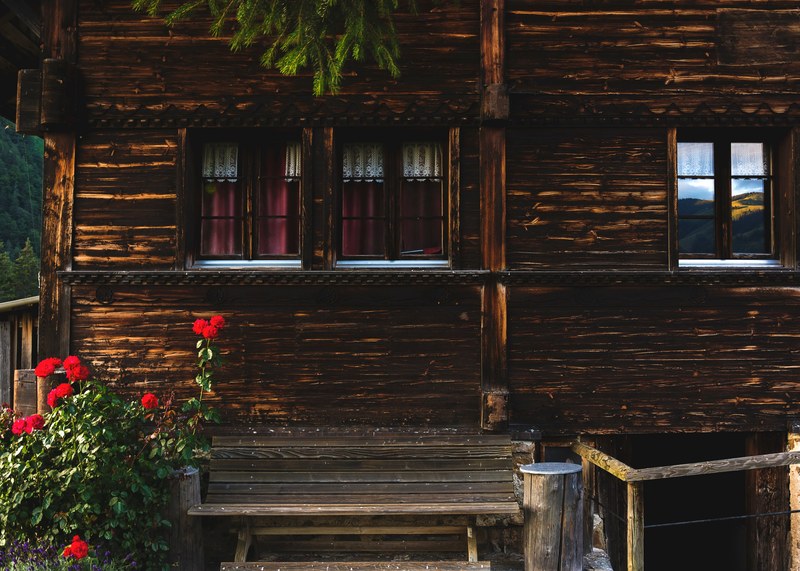 rolling hills reflected in the small window of a quiet cottage, cottage in the woods 4k