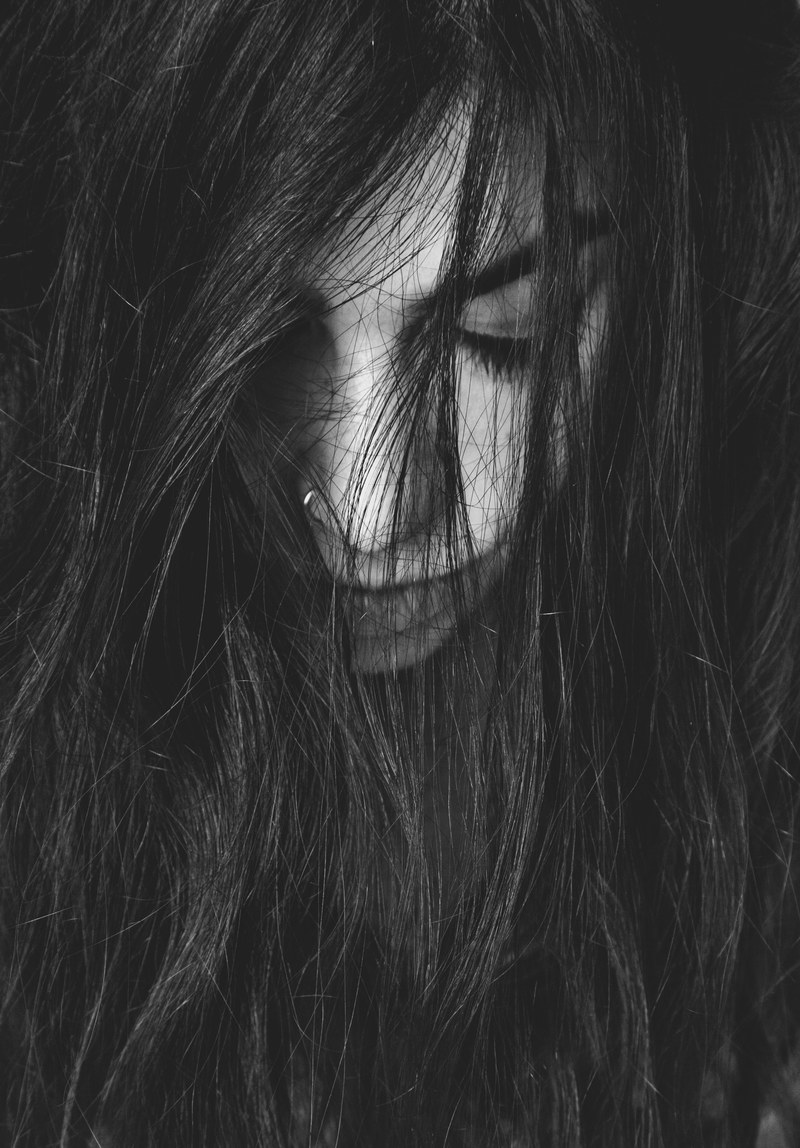 black and white close up shot of young woman with hair over face in bristol, woman hair over face bristol 4k