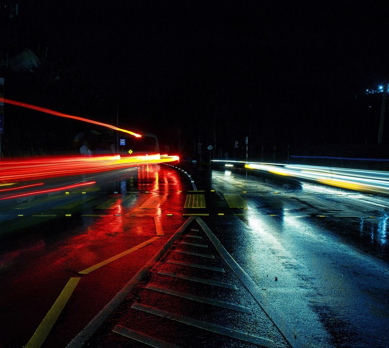 multi lane bridge at night with car light trails, a day out in the rain 4k