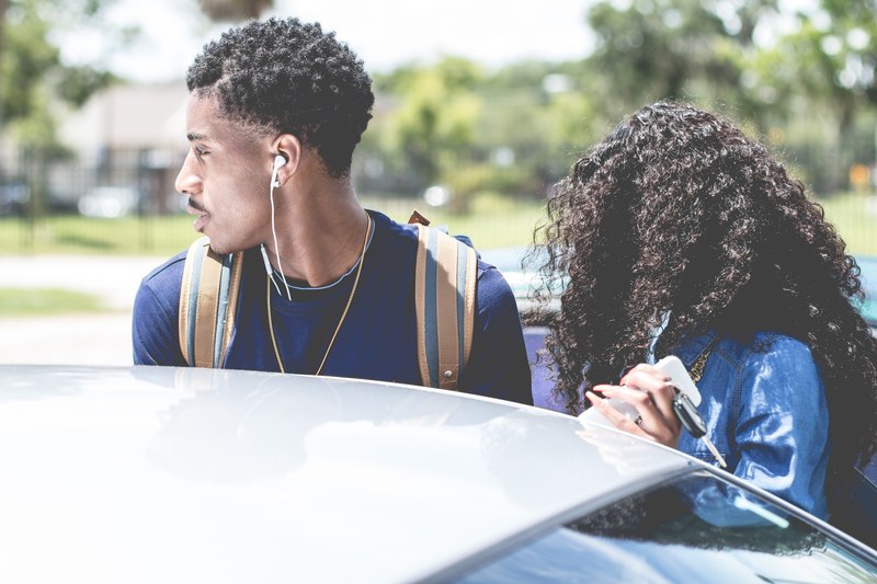 young fashionable couple with backpack and headphones at daytona beach near car, arriving at daytona beach 4k