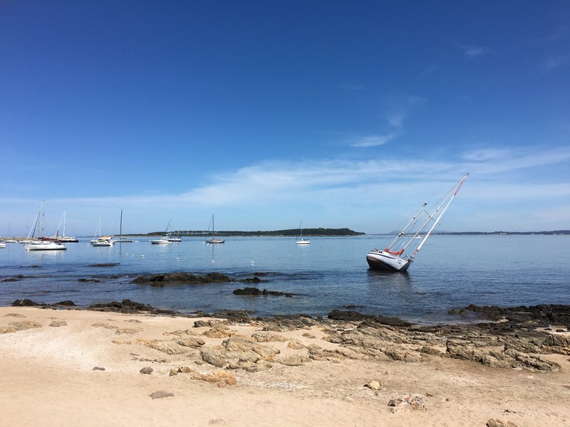 tilted boat near the harbor by the sand beach at puerto de punta del este, tilted boat near harbor 4k