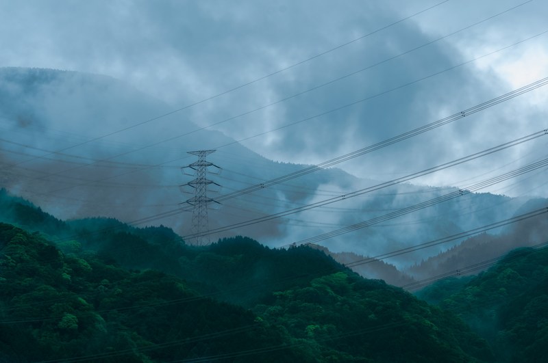 a number of power lines between transmission towers on wooded hills, power lines 4k