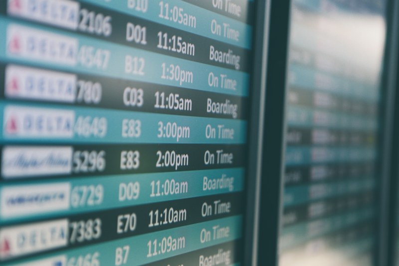airport departures timetable showing delta and alaska airlines flights on time and boarding, airport departures timetable 4k