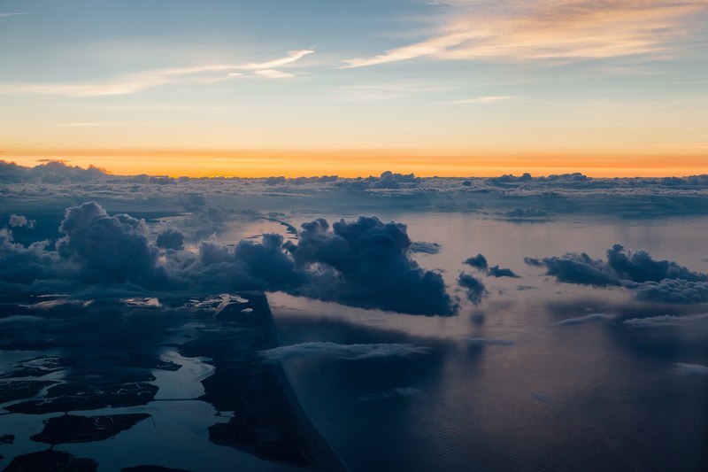 drone view of clouds above the long beach coastline, clouds above ocean drone view 4k