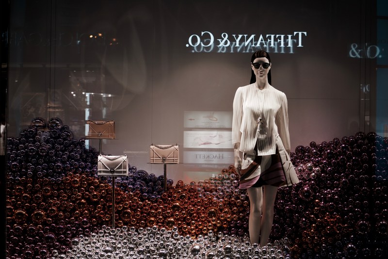 tiffany an co christmas window display with holiday ornaments and a fashionable mannequin, fashion christmas 4k