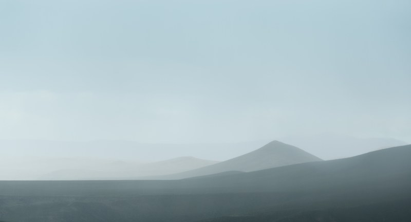 fuzzy silhouettes of steep hills in a mist, hazy hills silhouettes 4k