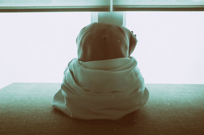 a photo take from behind a hunched over in pleiku, pleiku vietnam meditation 4k