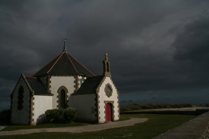 storm clouds rolls in the sky over an isolated church, church in a storm 4k