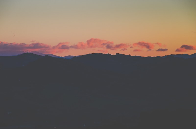 the mountain range in olmatello with orange clouds during sunset, skyline 4k