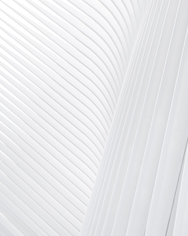a white stripe pattern made up of concrete facade ribs, oculus nyc facade 4k