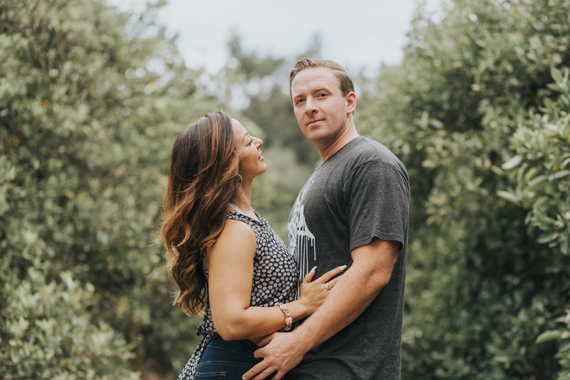 happy couple embracing in a field of trees, my wife and i 4k