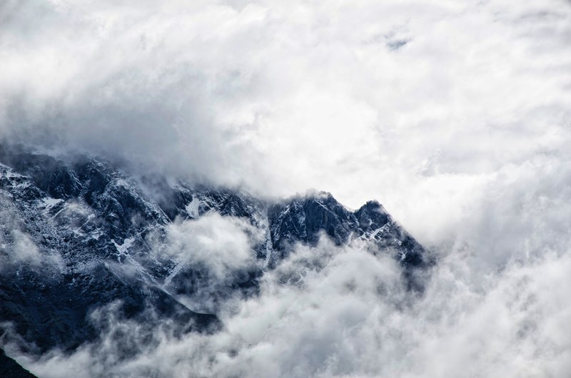 cold clouds cover caucasus mountains on a foggy winter day, clouds over the caucasus mountains 4k