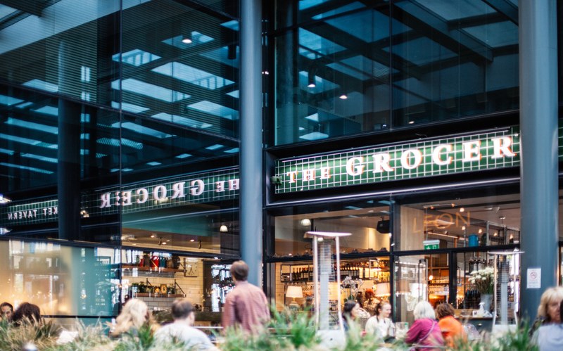 the exterior view of a grocery store in old spitalfields market, _outside old spitalfields market 4k