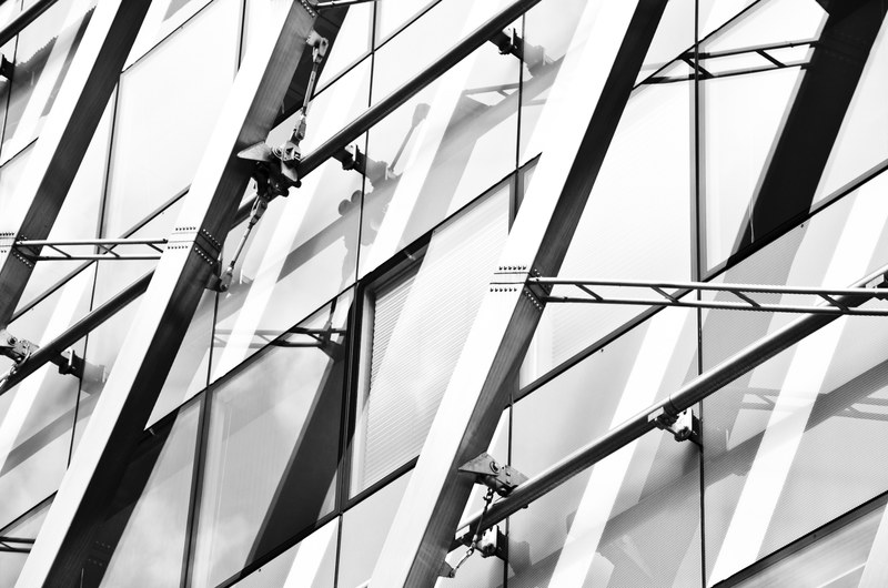 black and white shot of steel building cables and pattern on skyscraper in prag, steel architecture in prag 4k