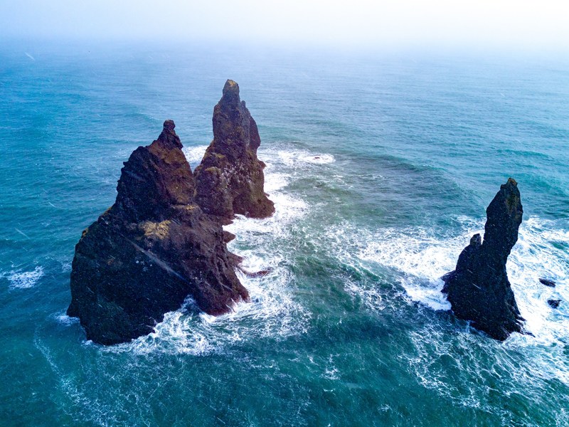 the famous rocks in black sand beach iceland 4k