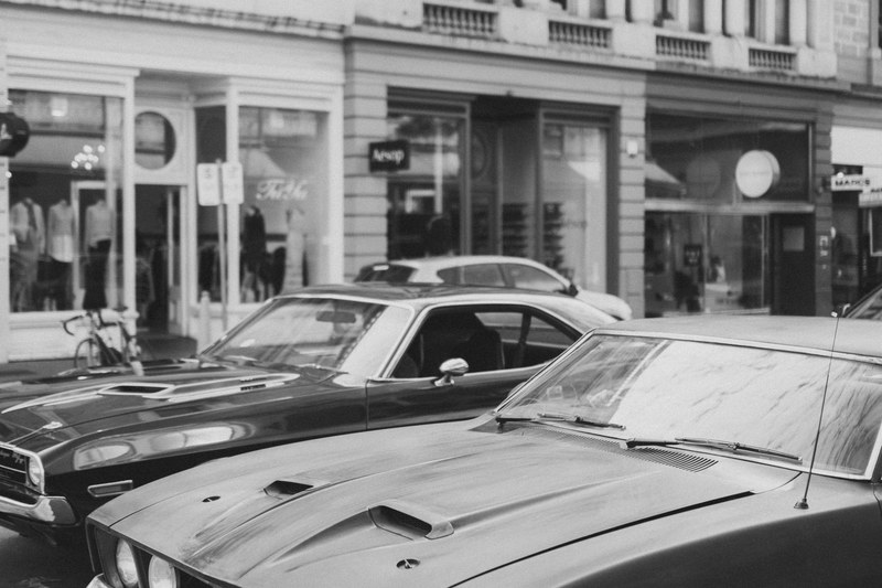 black and white shot of two muscle cars in urban street rundle street, muscle cars at rundle street 4k