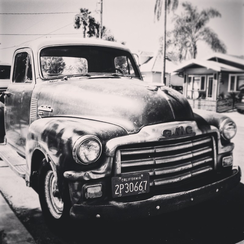 black and white photo of vintage truck parked in a beach setting, _monochrome vintage truck 4k