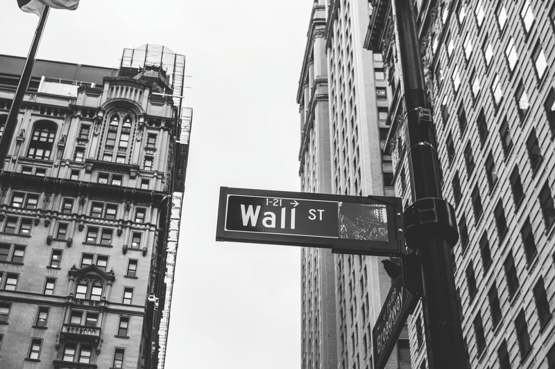 a street sign pointing to wall street in black and white, monochrome wall street sign 4k