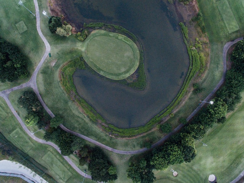 golf golf course look down and water 4k