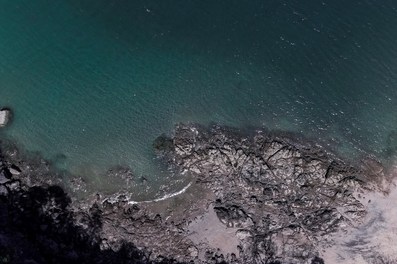 drone view of a rocky coast by the ocean in flamingocostarica, lost time from above_ 4k