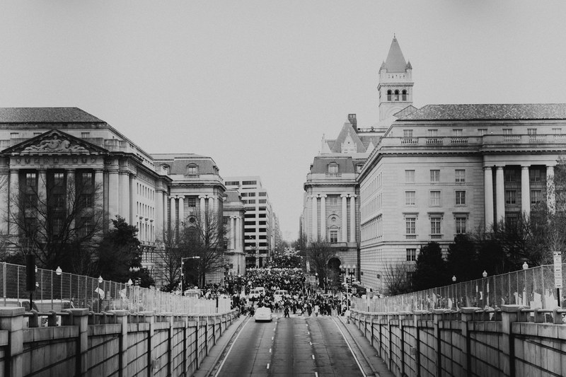 black and white shot of feminist equality protest in street from distance in washington, womans march 4k