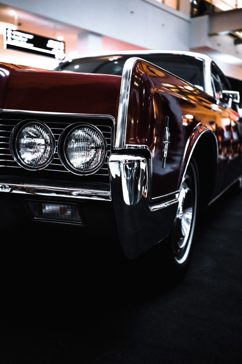 headlight and front hood details on a shiny vintage car, shiny vintage car 4k