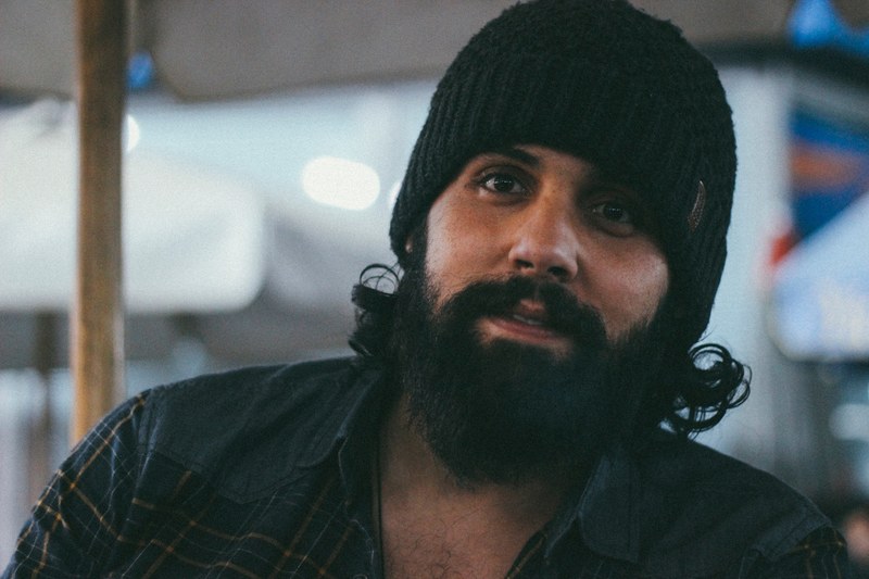 happy hipster man with a bear waring a beanie, he still thinking 4k