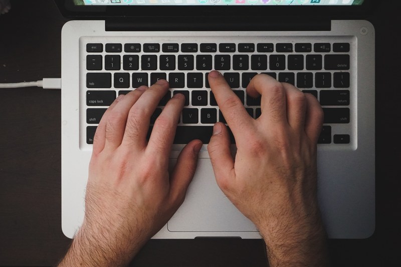 hand typing keyboard and laptop 4k