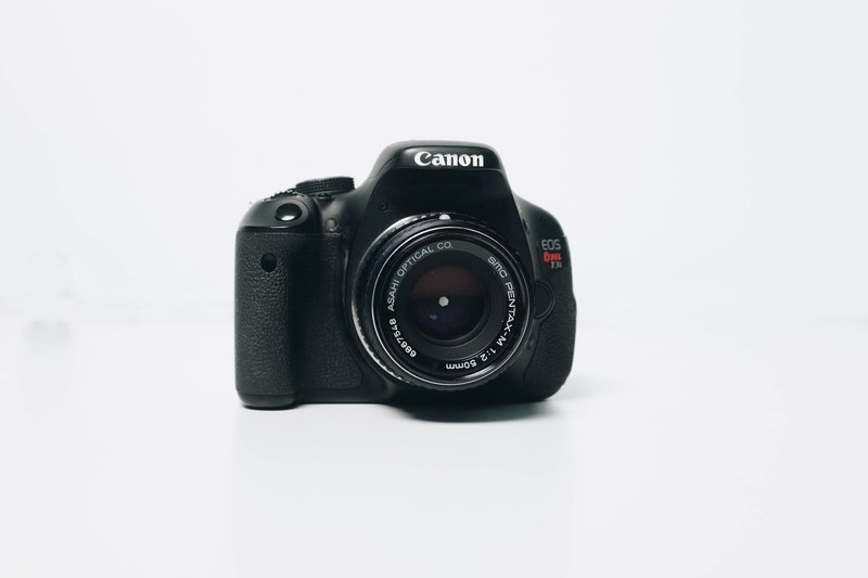 canon eos rebel t3i in a white background, black camera on white 4k
