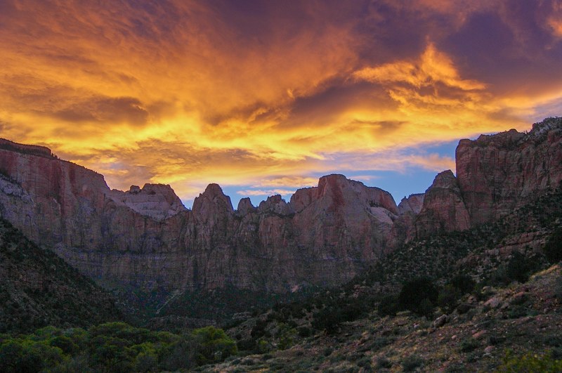 orange clouds over a rocky mountain landscape in zion national park, echo 4k