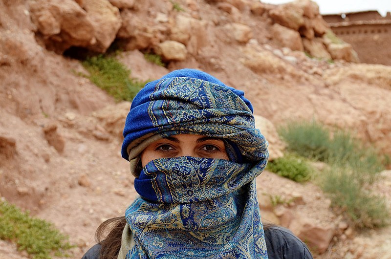 portrait of woman in a headscarf in the merzouga erg chebbi desert, woman in the desert 4k