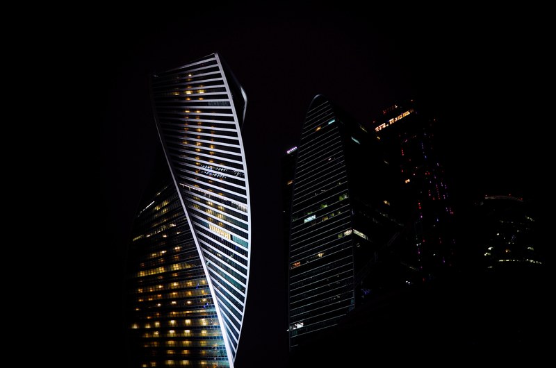 twisting facades of office buildings in moscow at night, twisting building facade 4k