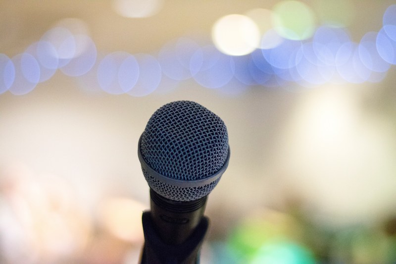 an microphone in a stand with bokeh effect in the background, microphone in a stand 4k