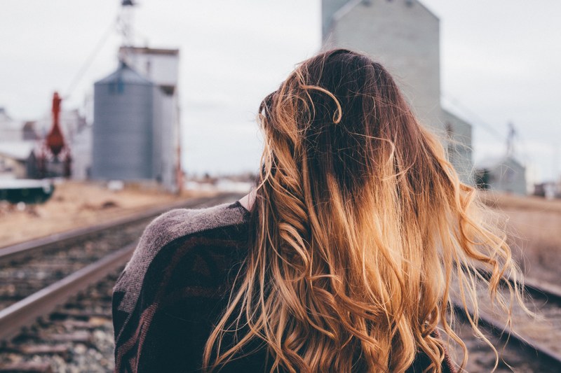 a woman with ombre hair standing on the train tracks in new york texas united states, ombre hair 4k
