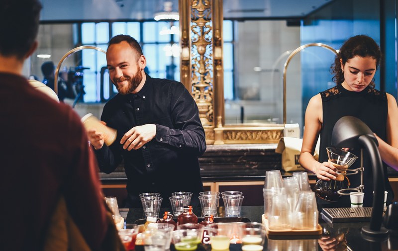 bartenders of different genders serving cocktail drinks in a bar, bartenders serving cocktail 4k