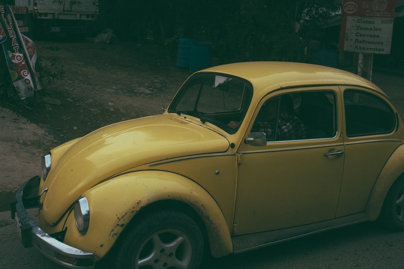 underexposed shot of a vintage yellow volkswagen beetle, _vintage yellow beetle 4k