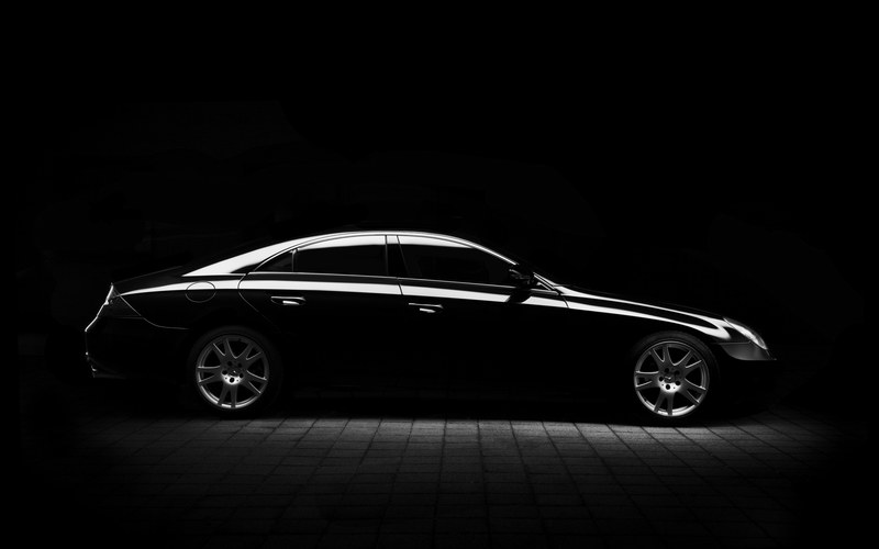 black and white shot of black mercedes benz saloon car on pavement at night, mercedes minimal silhouette 4k