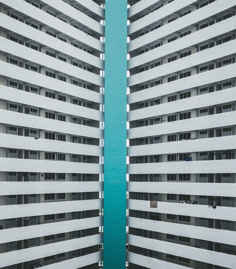 azure sea framed by twin tower blocks in singapore, sea between tower blocks 4k
