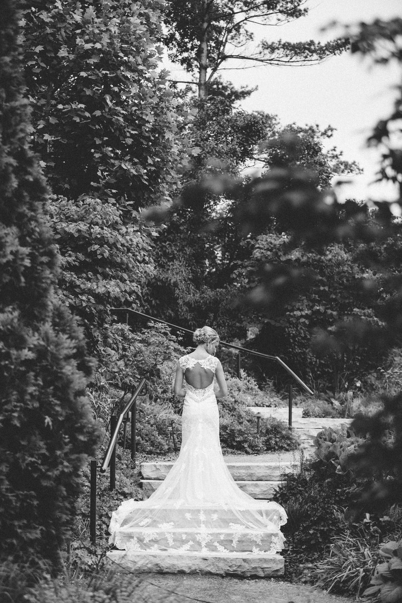 black and white shot of woman in wedding dress from behind greater des moines botanical garden, monochrome wedding dress 4k