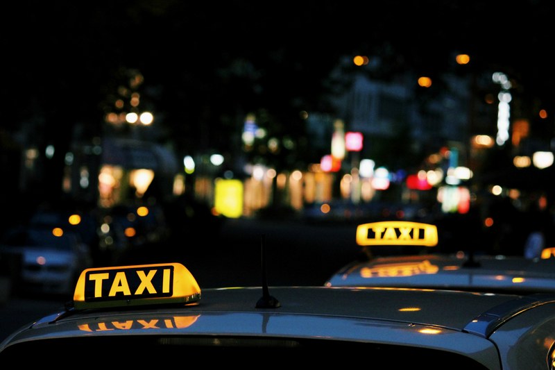 taxis at night in budapest with the city in the background, budapest taxis 4k