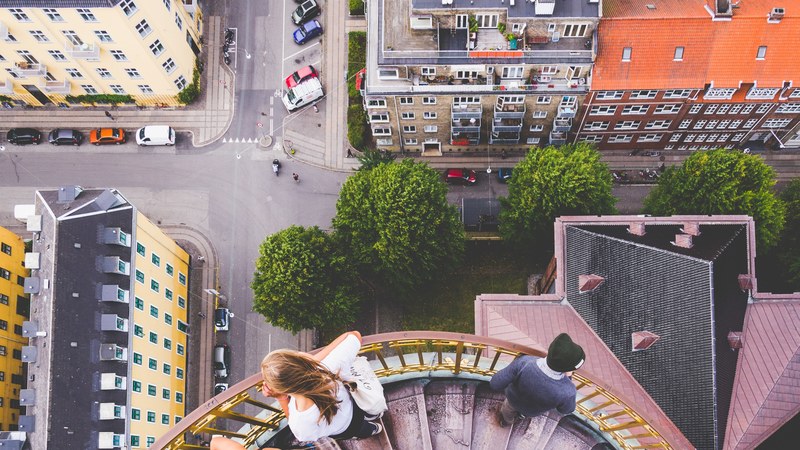 looking down at the avenue rooftops and stairs from a building top at kbenhavn denmark, down vor frelsers kirke 4k