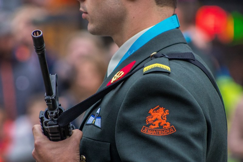 cropped side profile shot of a soldier holding a rifle, _the heroes for freedom 4k