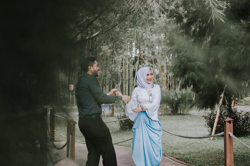 a man and woman in hijab dance on a path outside the hill hotel amp resort sibolangit, raga amp anisa 4k