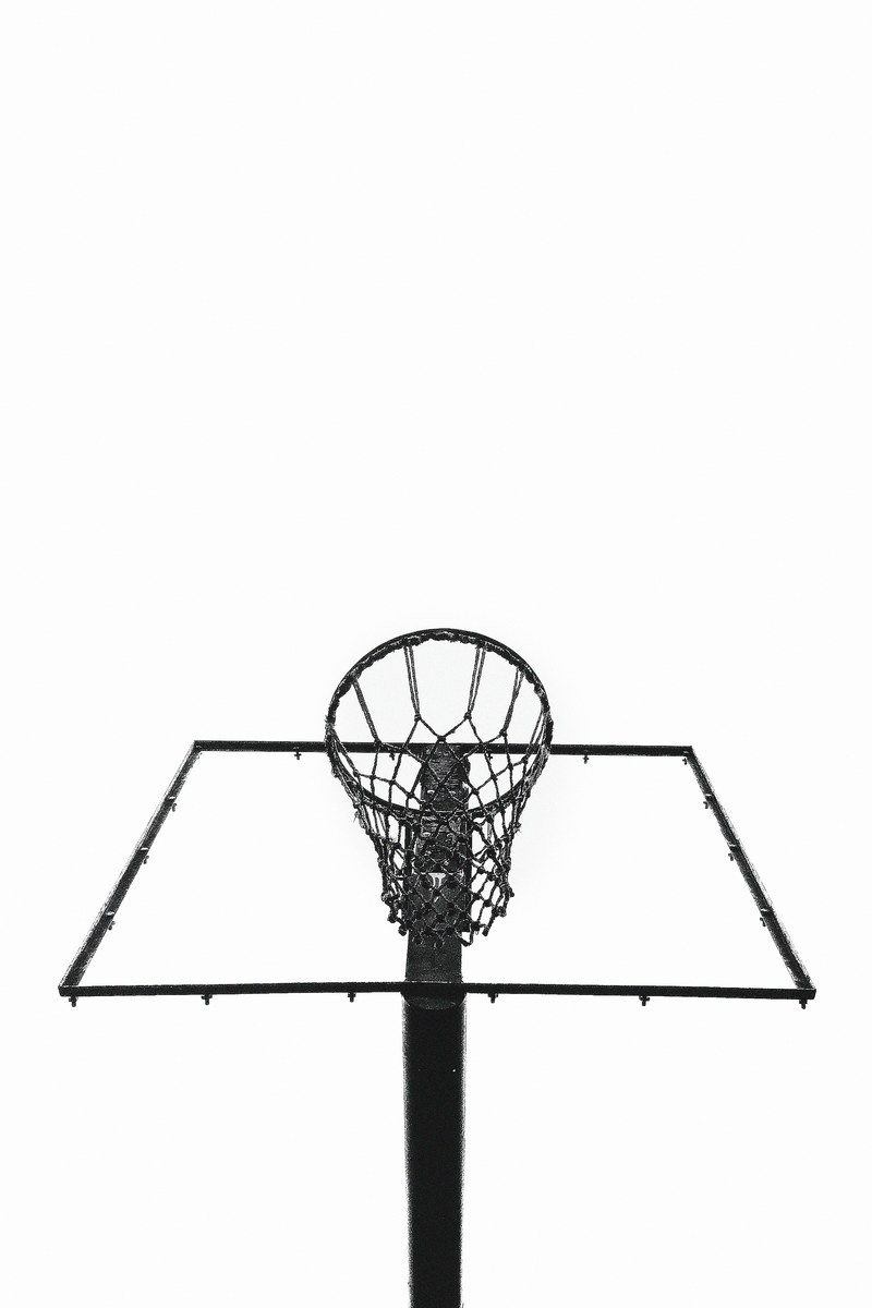 staring up at a basketball net hoop outside with complete whiteness in the background, _upward view basketball net 4k
