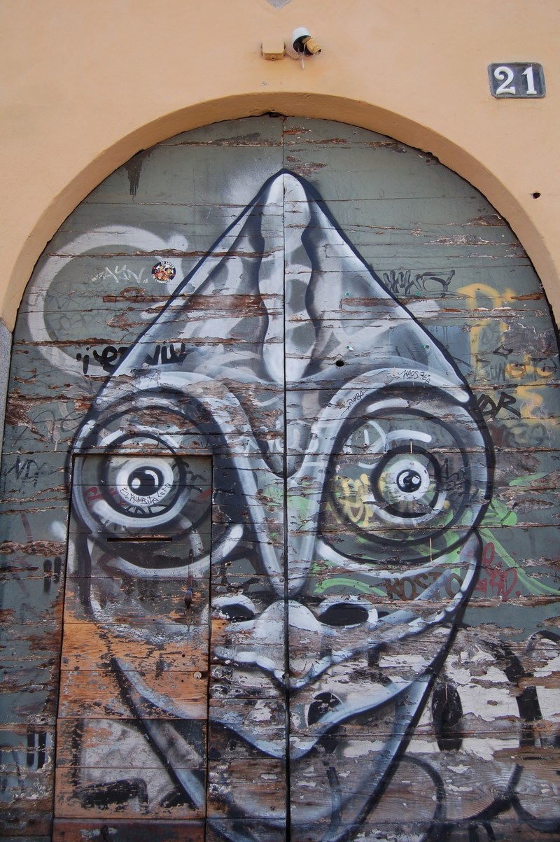 a vivid and imaginative character painted on a rounded door, _weird wall art 4k