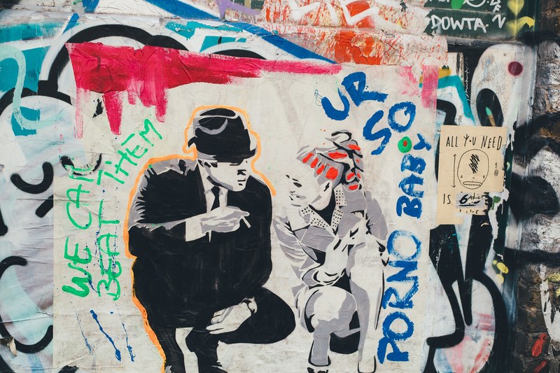 a graffiti graphic of a man in a suit with a top hat crouching while talking to a lady, _man woman talking graffiti 4k